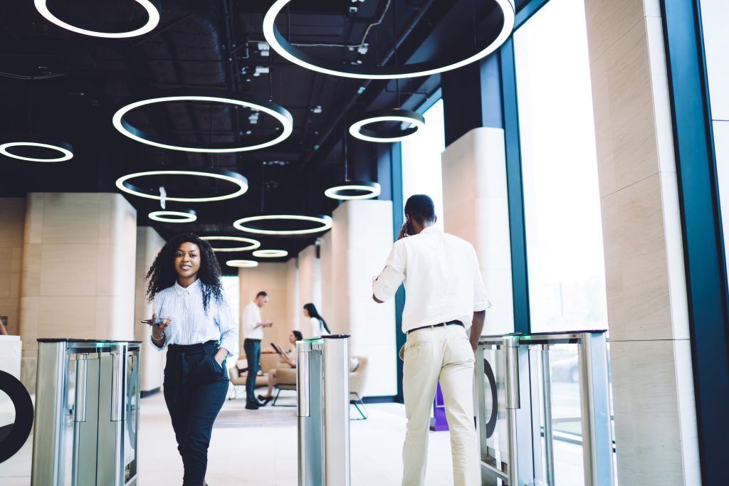 Content coworkers going through access control at workplace