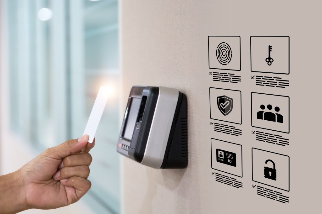 Hand scanning proximity ID card on reader access control system for door unlock with security icons for identity or verification identify for safety detect fingerprint scan or check attendance.